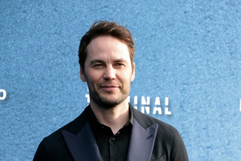 Taylor Kitsch arrives at the premiere of 