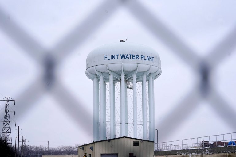 FILE - The Flint water plant tower is seen, Thursday, Jan. 6, 2022, in Flint, Michigan. Judge Elizabeth A. Kelly issued dismissals on Oct. 4 to seven former officials involved in the Flint water crisis, saying the indictments issued against the officials are invalid. (AP Photo/Carlos Osorio, File)