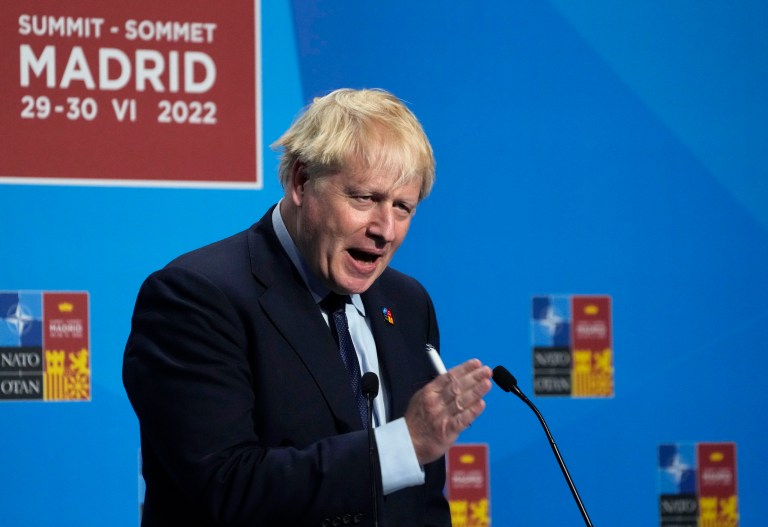 Boris Johnson fights for survival as top ministers resign
