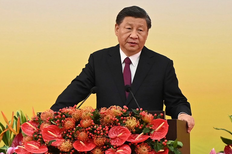 China's President Xi Jinping gives a speech following a swearing-in ceremony to inaugurate the city's new government in Hong Kong Friday, July 1, 2022, on the 25th anniversary of the city's handover from Britain to China. Xi Jinping wished U.S. President Joe Biden a successful recovery after Biden tested positive for COVID-19. (Selim Chtayti/Pool Photo via AP)