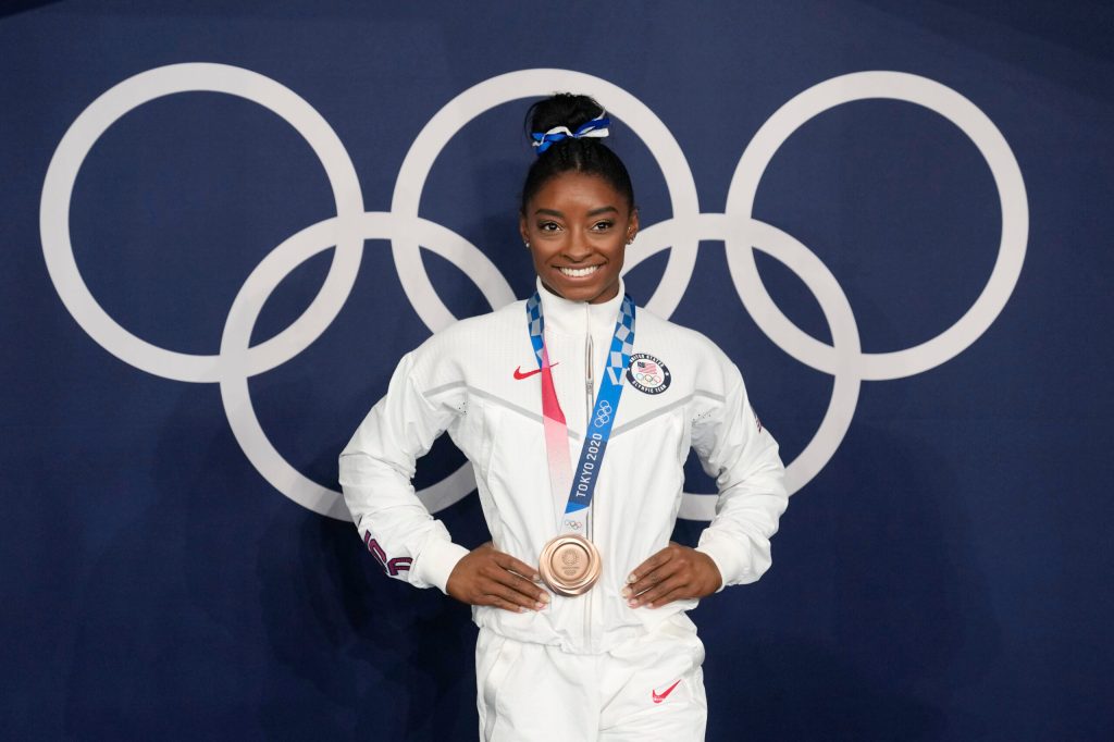 SEE IT: Simone Biles mistaken for child by flight attendant