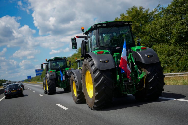 Demonstrating farmers slow down traffic on a motorway near Venlo, southern Netherlands, Monday, July 4, 2022.