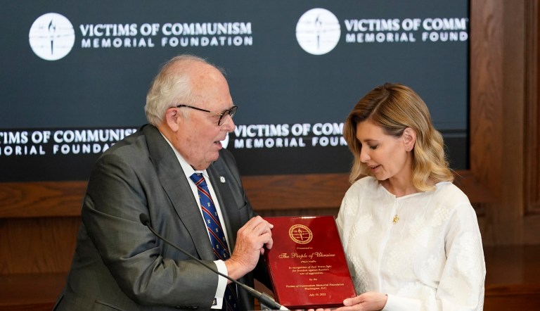 Olena Zelenska, spouse of Ukrainian's President Volodymyr Zelensky, accepts the Dissident Human Rights Award on behalf of the people of Ukraine for their brave fight against Russia from Dr. Edwin Feulner, chairman of the Victims of Communism Memorial Foundation, at the Victims of Communism Museum in Washington, Tuesday, July 19, 2022.