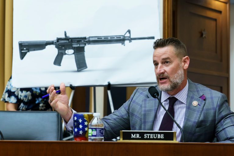Rep. Greg Steube, R-Fla., compares different models of firearms as the House Judiciary Committee holds a markup on the Assault Weapons Ban of 2021, at the Capitol in Washington, Wednesday, July 20, 2022.