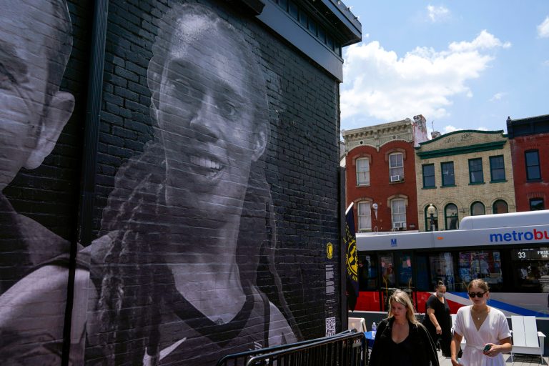 A mural depicting WNBA star Brittney Griner and other American hostages.