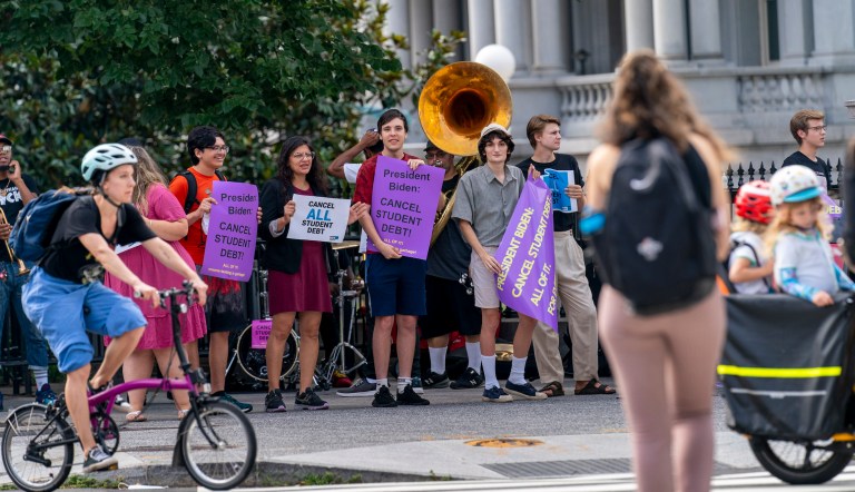 Biden’s dilemma: Cancel student loans or take credit for cutting deficit