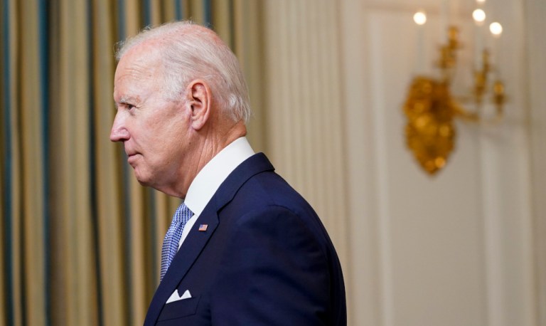 President Joe Biden leaves after speaking about 