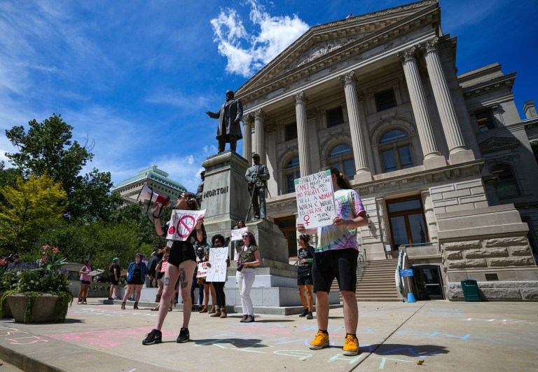 Abortion rights demonstrators protest outside the Indiana Statehouse during the special session on Friday in Indianapolis. 