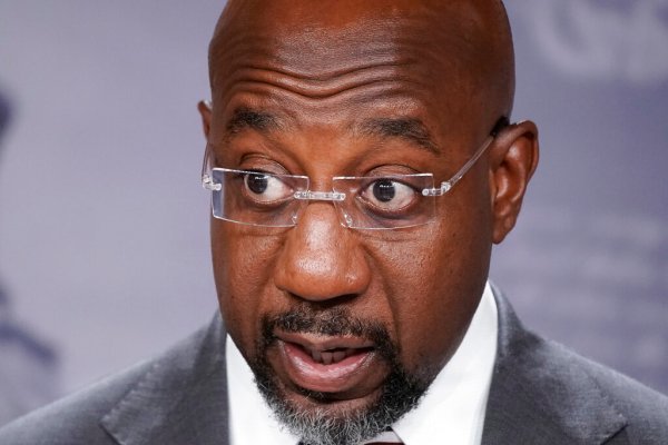 Dark money-linked PAC boosting Warnock paid Democratic superlawyer behind Trump-Russia dossier