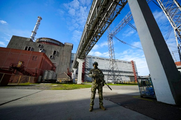 A Russian serviceman guards in an area of the Zaporizhzhia Nuclear Power Station in territory under Russian military control, southeastern Ukraine, on  May 1, 2022. 