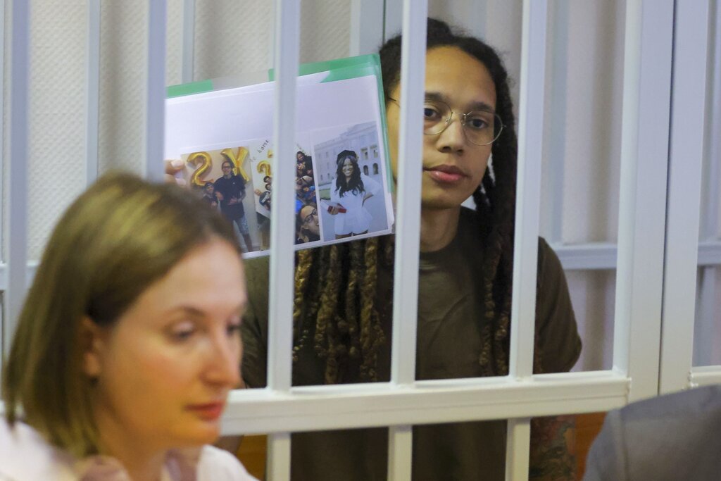 Brittney Griner holds up pictures of loved ones as trial in Russia starts to wrap up