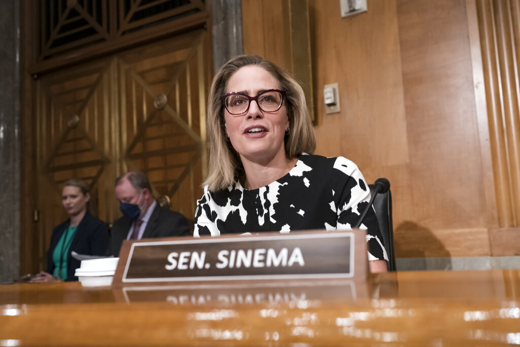 Senate Democrats wait as Sinema considers supporting Manchin-backed spending bill