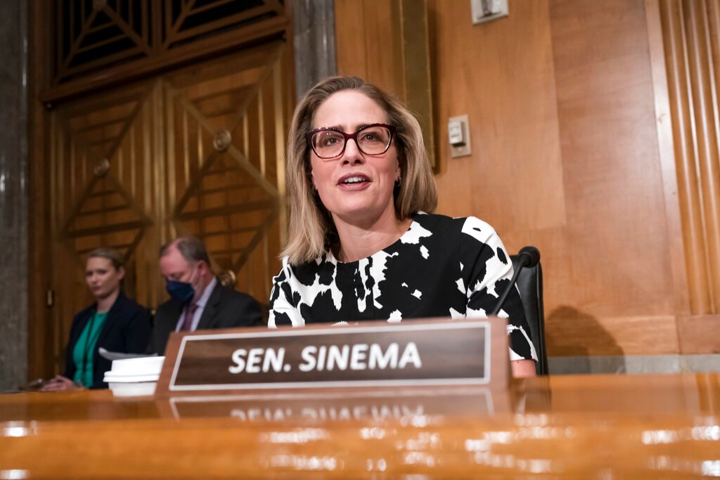 Senate Democrats wait as Sinema considers supporting Manchin-backed spending bill