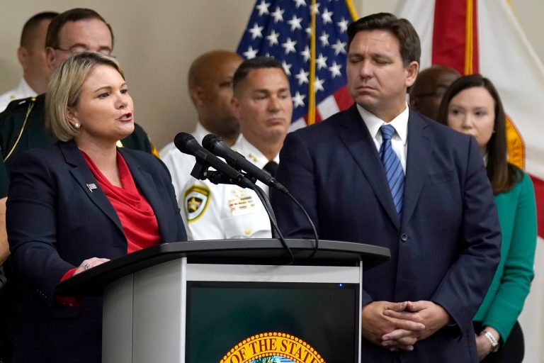 Judge Susan Lopez, left, acting Florida state attorney for the 13th Judicial Circuit, speaks during a news conference with Florida Gov. Ron DeSantis and Florida Attorney General Ashley Moody.