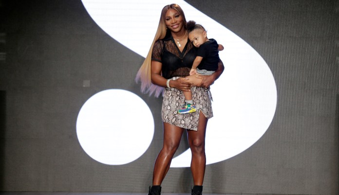 Serena Williams holds her daughter Alexis Olympia Ohanian Jr. after showing her clothing line during New York's Fashion Week in New York.