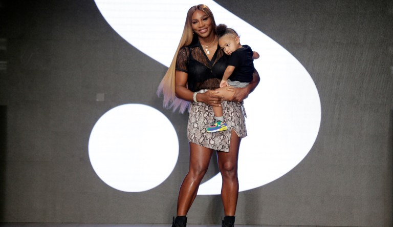Serena Williams holds her daughter Alexis Olympia Ohanian Jr. after showing her clothing line during New York's Fashion Week in New York.