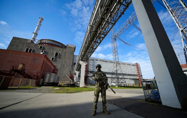 FILE - A Russian serviceman guards in an area of the Zaporizhzhia Nuclear Power Station in territory under Russian military control, southeastern Ukraine, on May 1, 2022. The Zaporizhzhia plant is in southern Ukraine, near the town of Enerhodar on the banks of the Dnieper River. 