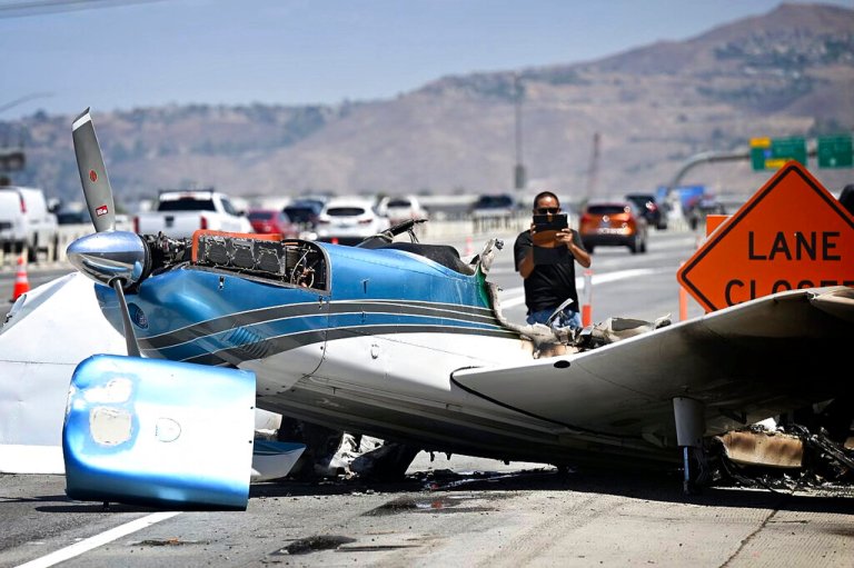 The burned remains of a small airplane that crashed on the 91 Freeway, west of the 15 Freeway in Corona.