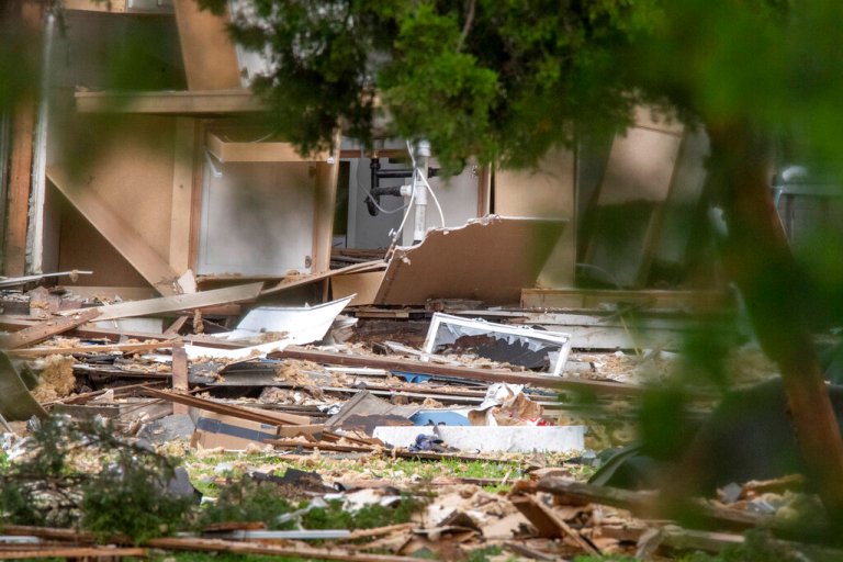 Emergency crews respond to a house explosion on North Weinbach Avenue in Evansville, Ind., Wednesday afternoon, Aug. 10, 2022.