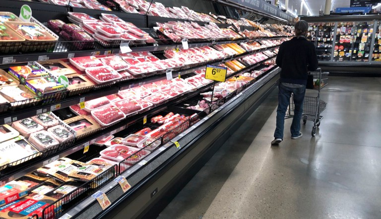 Wholesale inflation A shopper pushes his cart past a display of packaged meat in a grocery store in southeast Denver. Prices at the wholesale level fell from June to July, the first month-to-month drop in more than two years and a sign that some of the U.S. economy's inflationary pressures cooled last month.