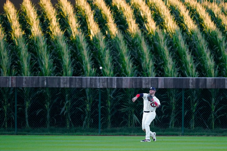 Chicago Cubs left fielder Ian Happ (8) throws the ball in after a Cincinnati Reds Donovan Solano hit in the third inning during a baseball game at the Field of Dreams movie site, Thursday, Aug. 11, 2022, in Dyersville, Iowa.