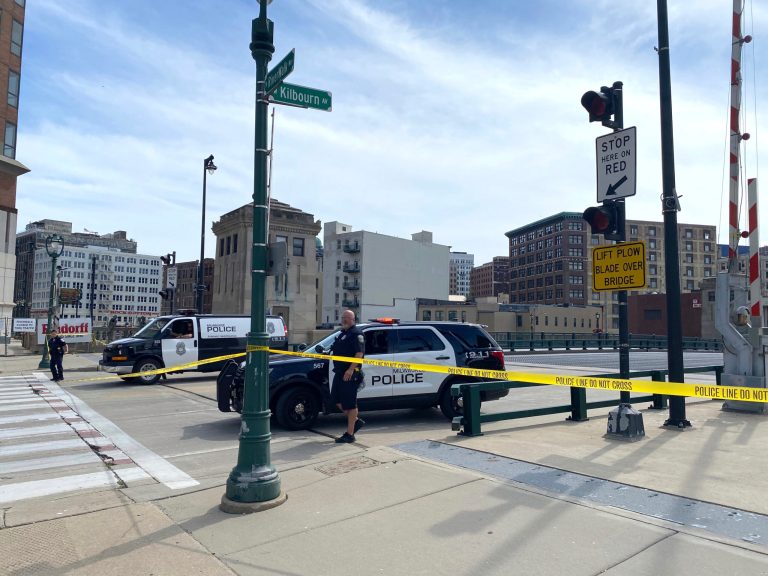 Police officers close off access to the Kilbourn Avenue Bridge after a 77-year-old man was found dead on the bridge Monday Aug. 15, 2022 in Milwaukee.