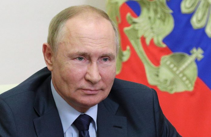 Russian President Vladimir Putin attends a meeting via a video conference link at the Novo-Ogaryovo state residence, outside Moscow, Russia, Wednesday, Aug. 17, 2022. The Russian government announced this week that the title of "Mother Heroine" will be awarded to Russian women who "birth and raise" 10 Russian citizens, reviving the reward given to mothers of 10 or more children given in Russia before the Soviet Union's fall in 1991. (Mikhail Klimentyev, Sputnik, Kremlin Pool Photo via AP)