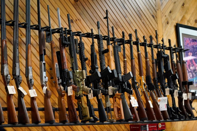 Various guns are displayed at a store on July 18, 2022, in Auburn, Maine. Most U.S. adults think gun violence is increasing nationwide and want to see gun laws made stricter. That's according to a new poll that finds broad public support for a variety of gun restrictions. The poll comes from the University of Chicago Harris School of Public Policy and The Associated Press-NORC Center for Public Affairs Research.