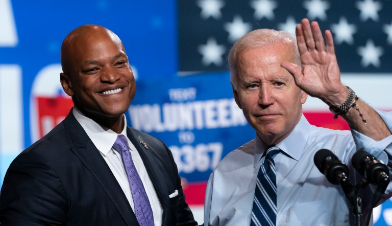 President Joe Biden (right) waves with gubernatorial candidate Wes Moore (D-MD) (left) during a rally for the Democratic National Committee on Thursday, Aug. 25, 2022, at Richard Montgomery High School in Rockville, Maryland.