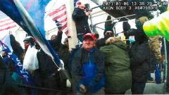 WATCH: New Jan. 6 footage shows mob using enormous Trump sign as battering ram