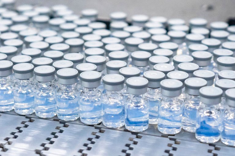 This August 2022 photo provided by Pfizer shows vials of the company's updated COVID-19 vaccine during production in Kalamazoo, Mich.  