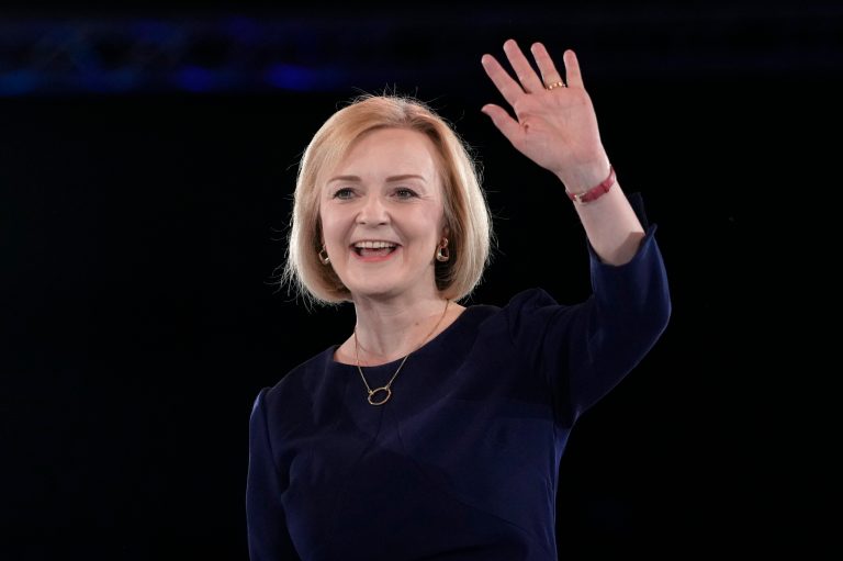 Liz Truss, Britain's new prime minister, waves on stage after a Conservative leadership election hustings at Wembley Arena in London, Wednesday, Aug. 31, 2022. 