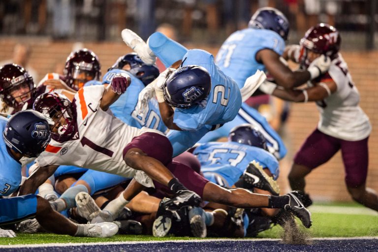 Old Dominion running back Blake Watson (2) scores a go-ahead touchdown against Virginia Tech during the second half of an NCAA college football game Friday, Sept. 2, 2022, in Norfolk, Va. Halftime during Friday night's game lasted over 30 minutes due to Tech's coaching staff getting stuck in an elevator. (AP Photo/Mike Caudill)