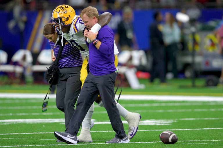 LSU defensive tackle Maason Smith (0) comes off the field with aid during the first half of an NCAA football game against Florida State on Saturday, Sept. 4, 2022, in New Orleans. 