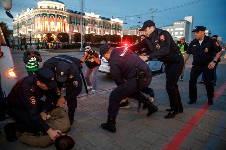 Police detain demonstrators during a protest against mobilization in Yekaterinburg, Russia, Wednesday, Sept. 21, 2022. Russian President Vladimir Putin has ordered a partial mobilization of reservists in Russia, effective immediately.  (AP Photo)