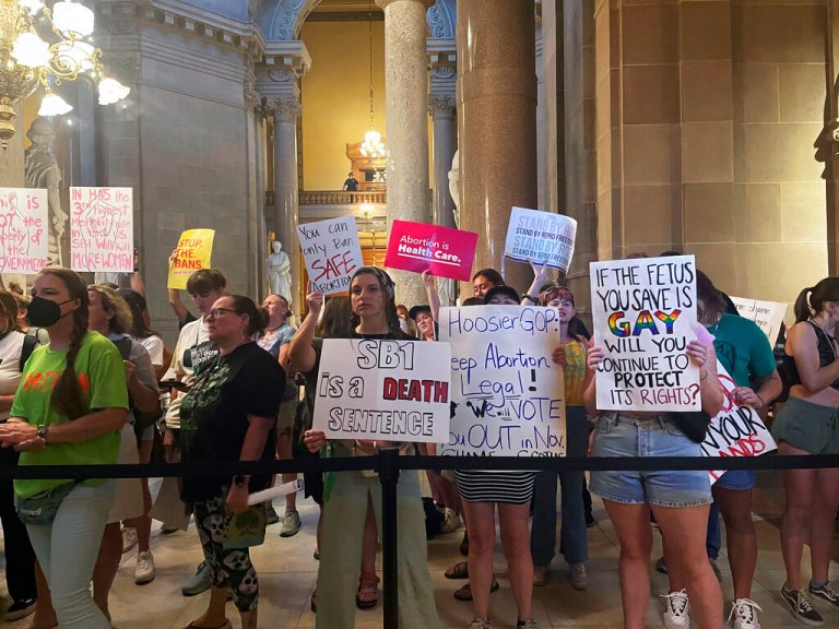 Abortion-rights protesters fill Indiana Statehouse corridors and cheer outside legislative chambers, Friday, Aug. 5, 2022, as lawmakers vote to concur on a near-total abortion ban, in Indianapolis. 