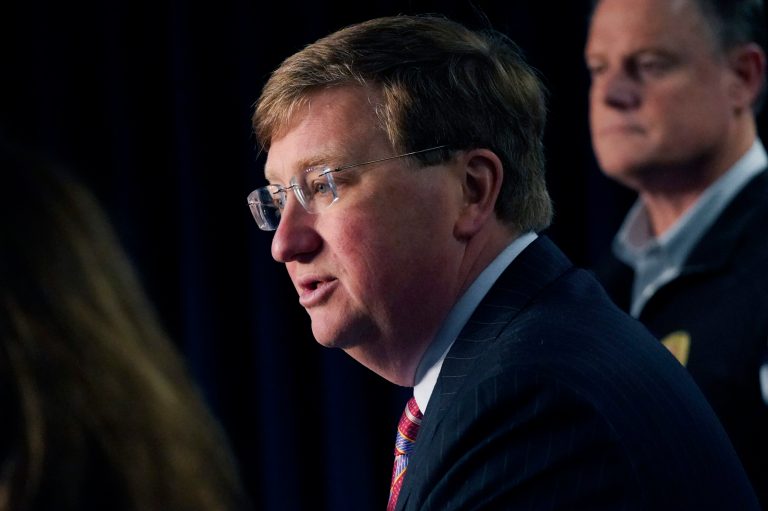 Mississippi Gov. Tate Reeves announces the state-imposed boil-water notice has been lifted in Mississippi's capital city after nearly seven weeks, during a Sept. 15, 2022, news conference in Jackson. 