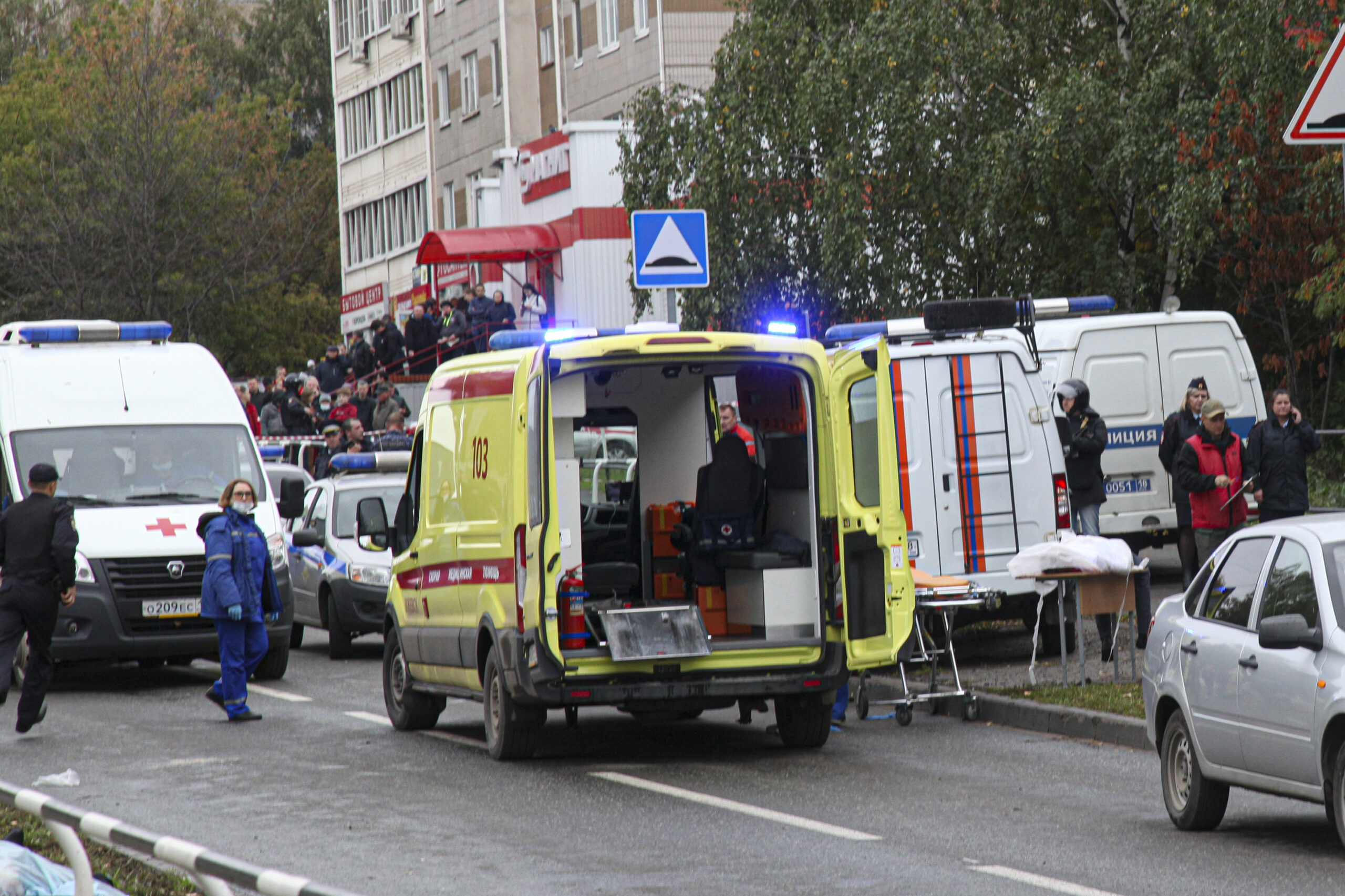 Swastika-wearing gunman kills 13 and wounds 21 others in school massacre