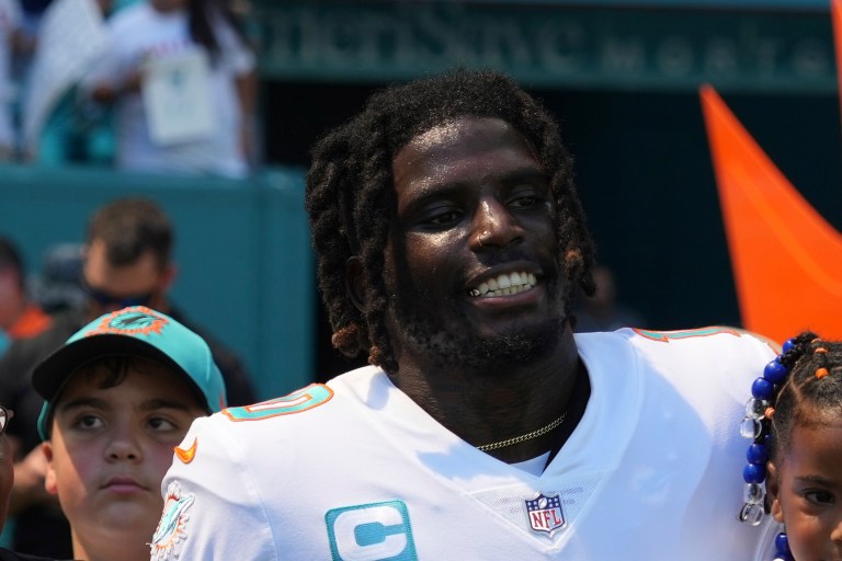 Miami Dolphins wide receiver Tyreek Hill smiles before an NFL football game against the Buffalo Bills, Sunday, September 25, 2022 in Miami Gardens, Florida.