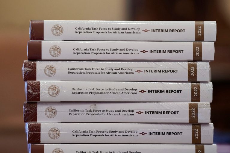 Copies of the interim report issued by California's first-in-the-nation task force on reparations for African Americans are seen at the Capitol in Sacramento, California, Thursday, June 16, 2022. 