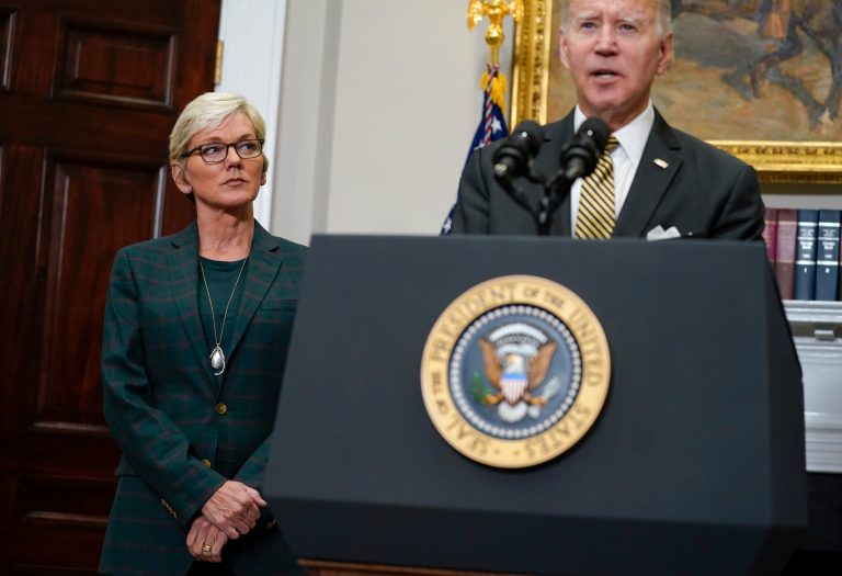Energy Secretary Jennifer Granholm listens as President Joe Biden speaks about energy and the Strategic Petroleum Reserve.