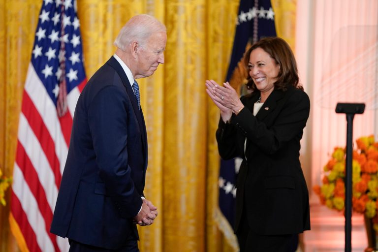 Vice President Kamala Harris applauds President Joe Biden after she introduced him to speak during an event to celebrate Diwali.