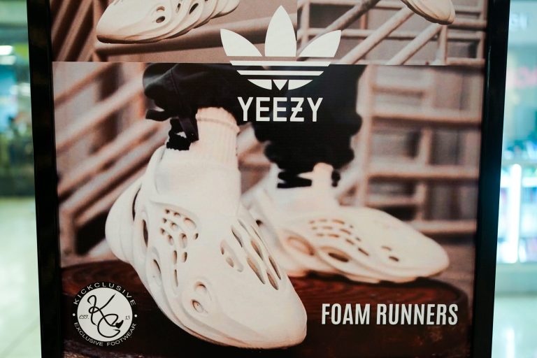 A sign advertises Yeezy shoes made by Adidas at Kickclusive, a sneaker resale store, in Paramus, N.J., Tuesday, Oct. 25, 2022. Adidas has ended its partnership with the rapper formerly known as Kanye West over his offensive and antisemitic remarks, the latest company to cut ties with Ye and a decision that the German sportswear company said would hit its bottom line. 