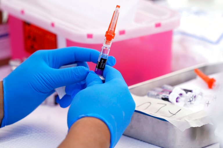 A flu vaccine is readied at the L.A. Care and Blue Shield of California Promise Health Plans' Community Resource Center where they were offering members and the public free flu and COVID-19 vaccines Friday, Oct. 28, 2022, in Lynwood, Calif. 