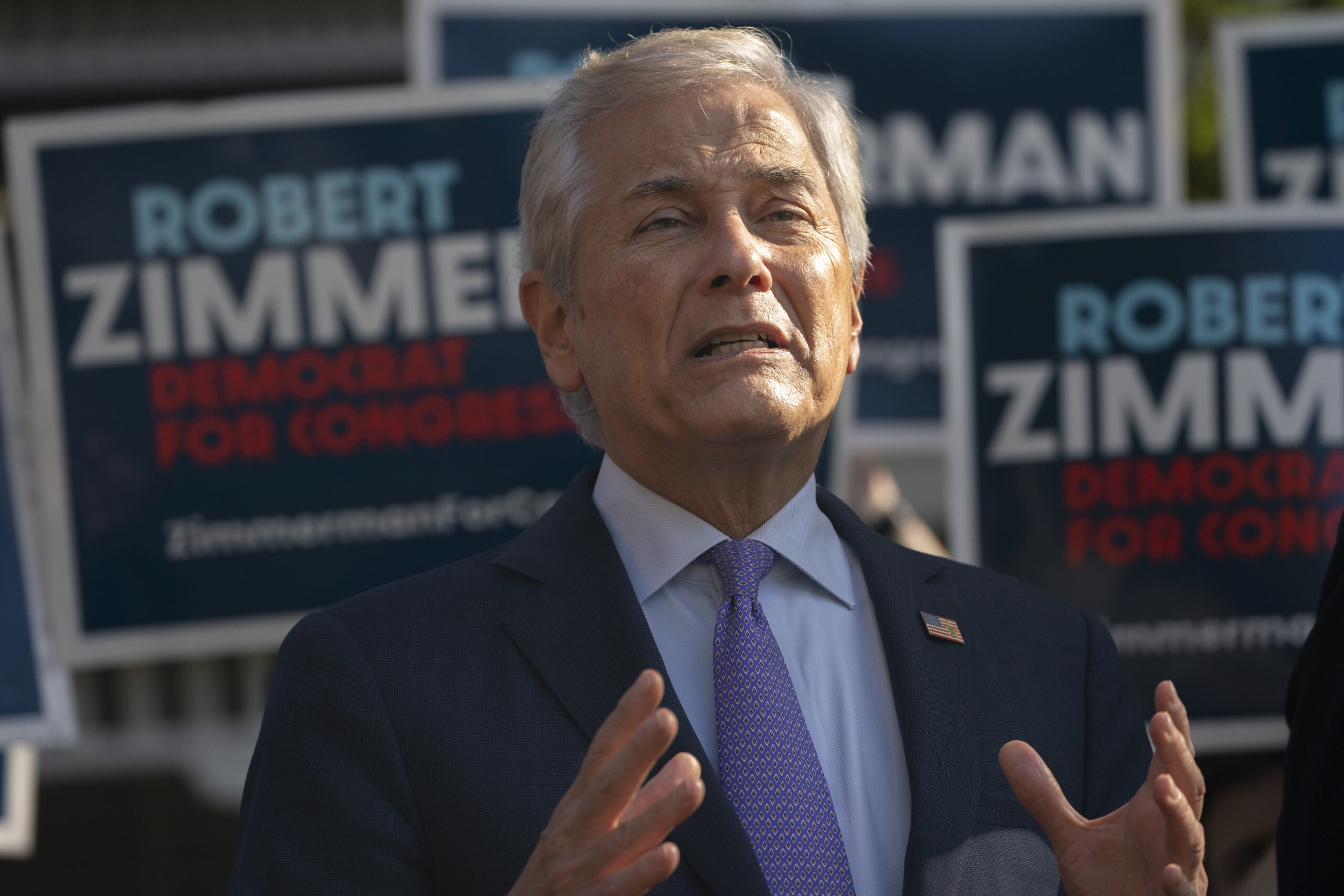 Democrat Robert Zimmerman challenges George Santos to resign and run again in special election