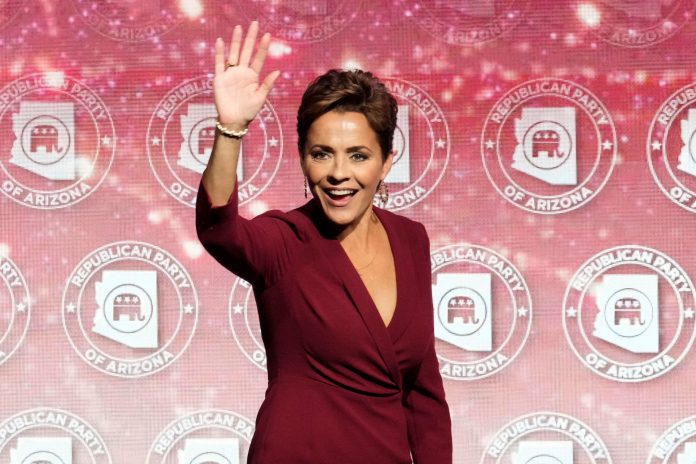 Kari Lake, Arizona Republican candidate for governor, waves to her supporters at the Republican watch party in Scottsdale, Arizona, Tuesday, Nov. 8, 2022.