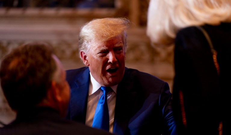 Former President Donald Trump speaks to guests at Mar-a-lago on Election Day, Tuesday, Nov. 8, 2022, in Palm Beach, Fla.
