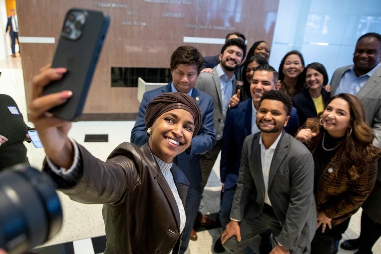 Members of the Congressional Progressive Caucus and other progressive candidates pose for a selfie taken by Rep. Ilhan Omar, D-Minn., at AFL-CIO headquarters in Washington on Sunday, Nov. 13, 2022.