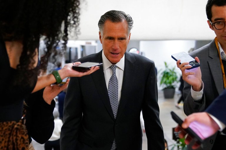 Sen. Mitt Romney, R-Utah, speaks with members of the press Nov. 16, 2022, on Capitol Hill in Washington.