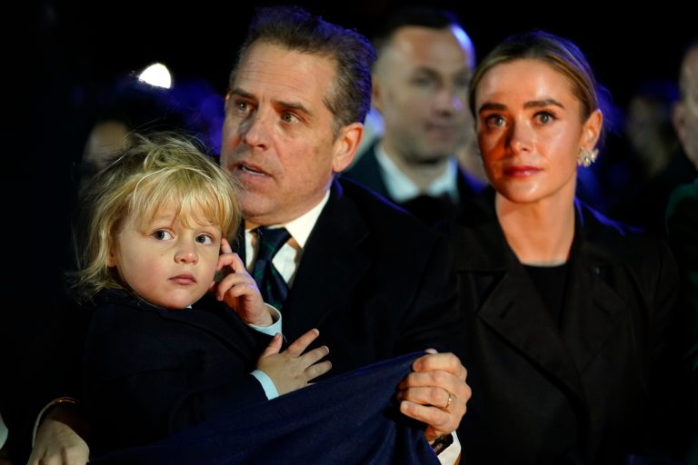 Hunter Biden, holding son Beau, and President Joe Biden's granddaughter Naomi Biden.